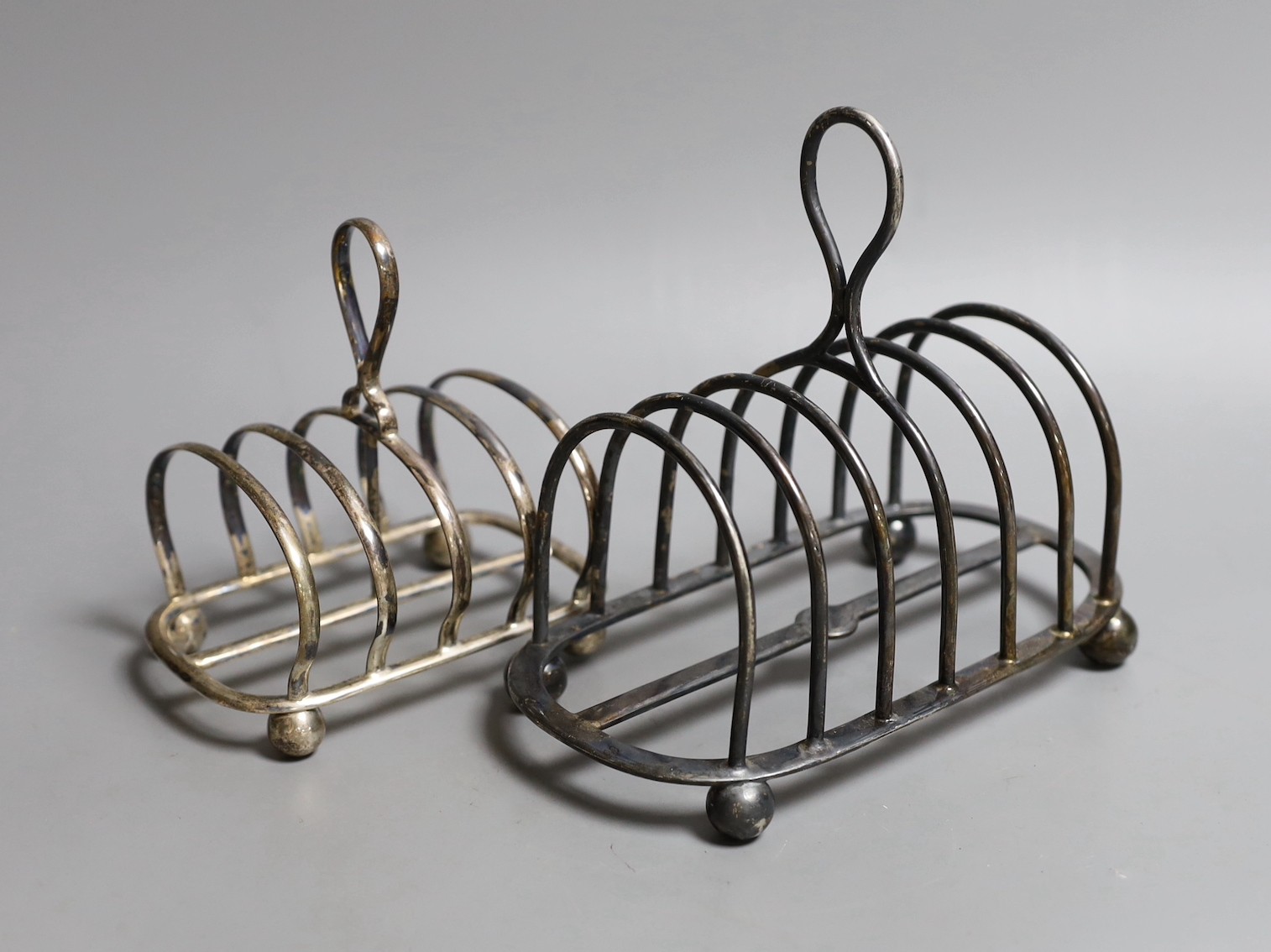 A late Victorian Irish silver seven bar toastrack, John Smyth, Dublin, 1898, length 17.5cm and one other later smaller toastrack by Mappin & Webb, 15.5oz.